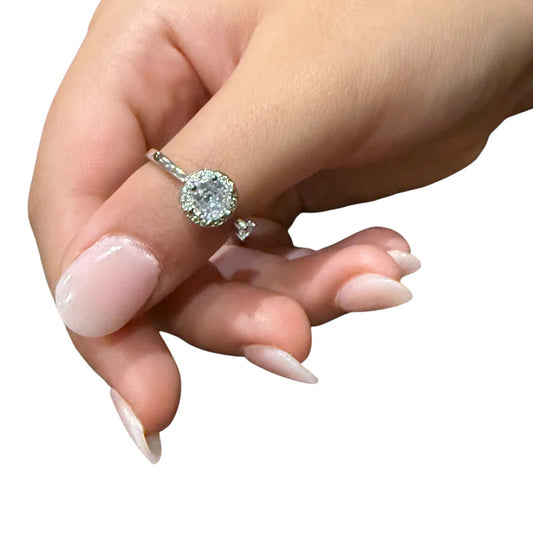 Mira fidget ring with large spinning diamante worn on the thumb