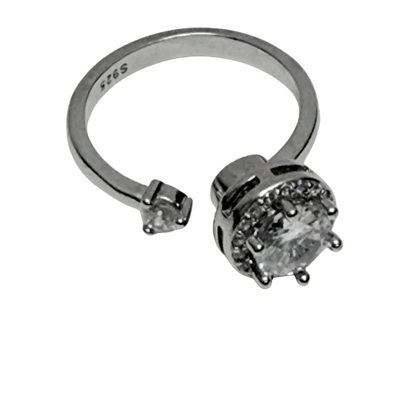 side view of the mira sterling silver fidget ring with large spinning diamante