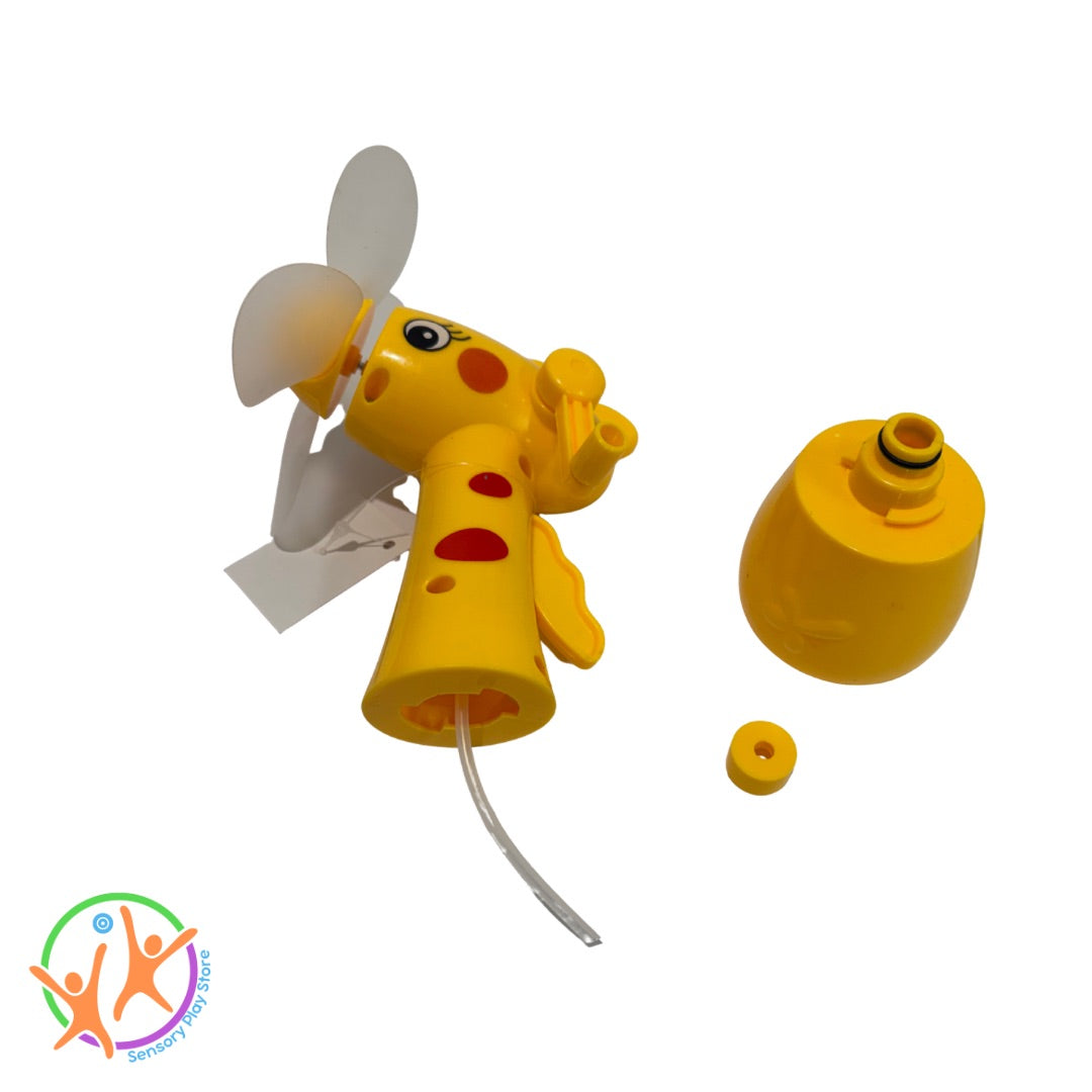 Yellow misting fan with a propeller and attached hose showing separate base