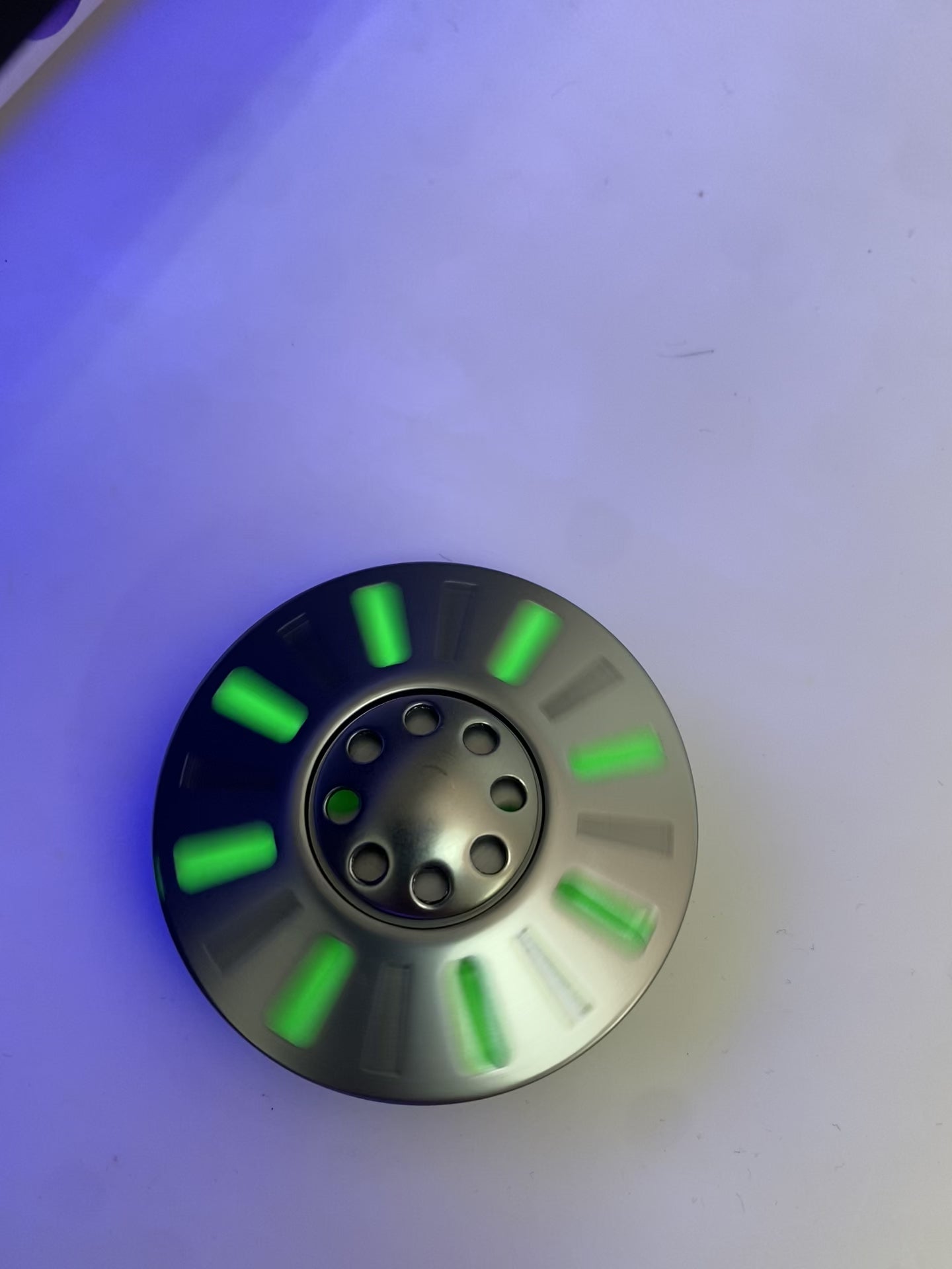 Video of UFO Spinner glowing under UV light 
