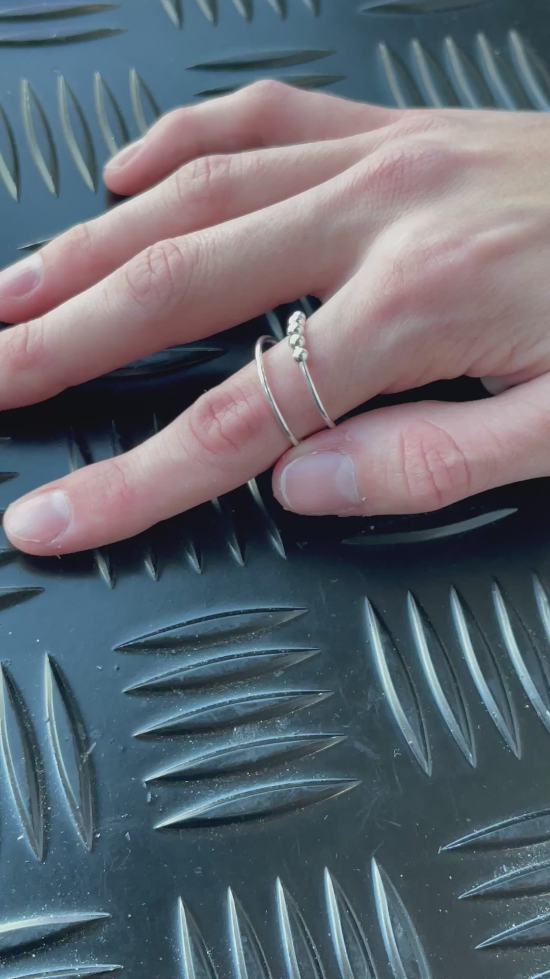 Spin the ring and slide the balls on the Riven Kaiko Fidget RIng