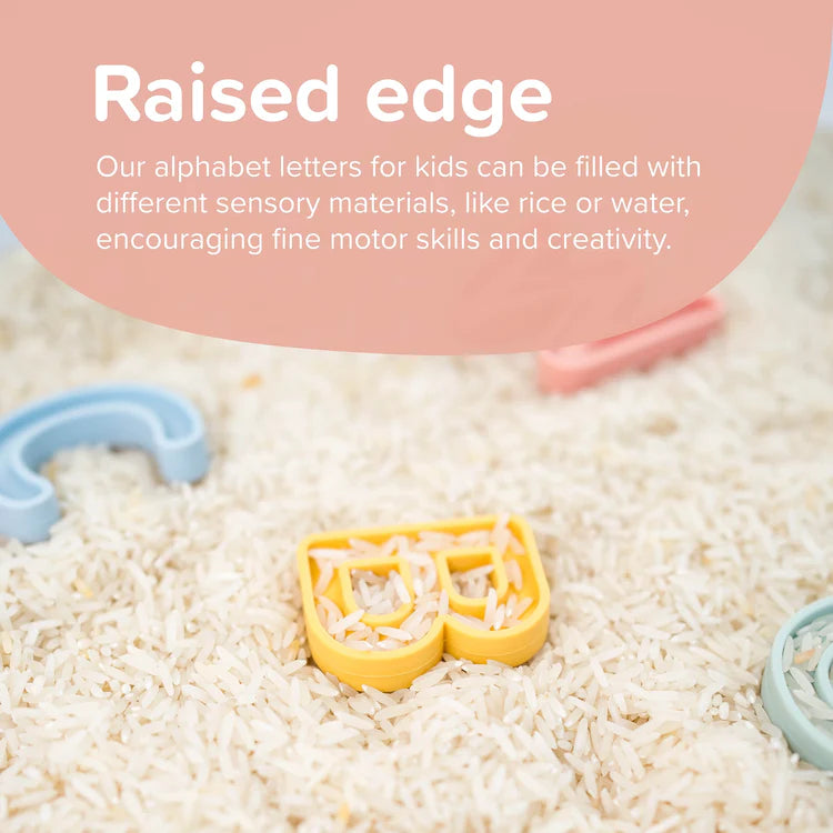 Silicone yellow letter 'B' shape filled with rice showing its raised edges